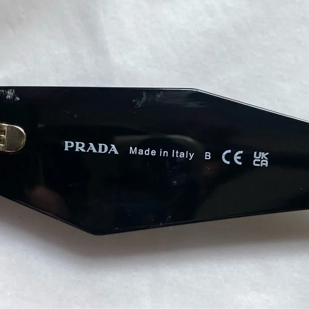 Prada Eyewear black square frame sunglasses logo sides Revolve in case $489